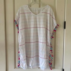 Beach cover-up. White V-neck. Colorful stripes and side tassels.